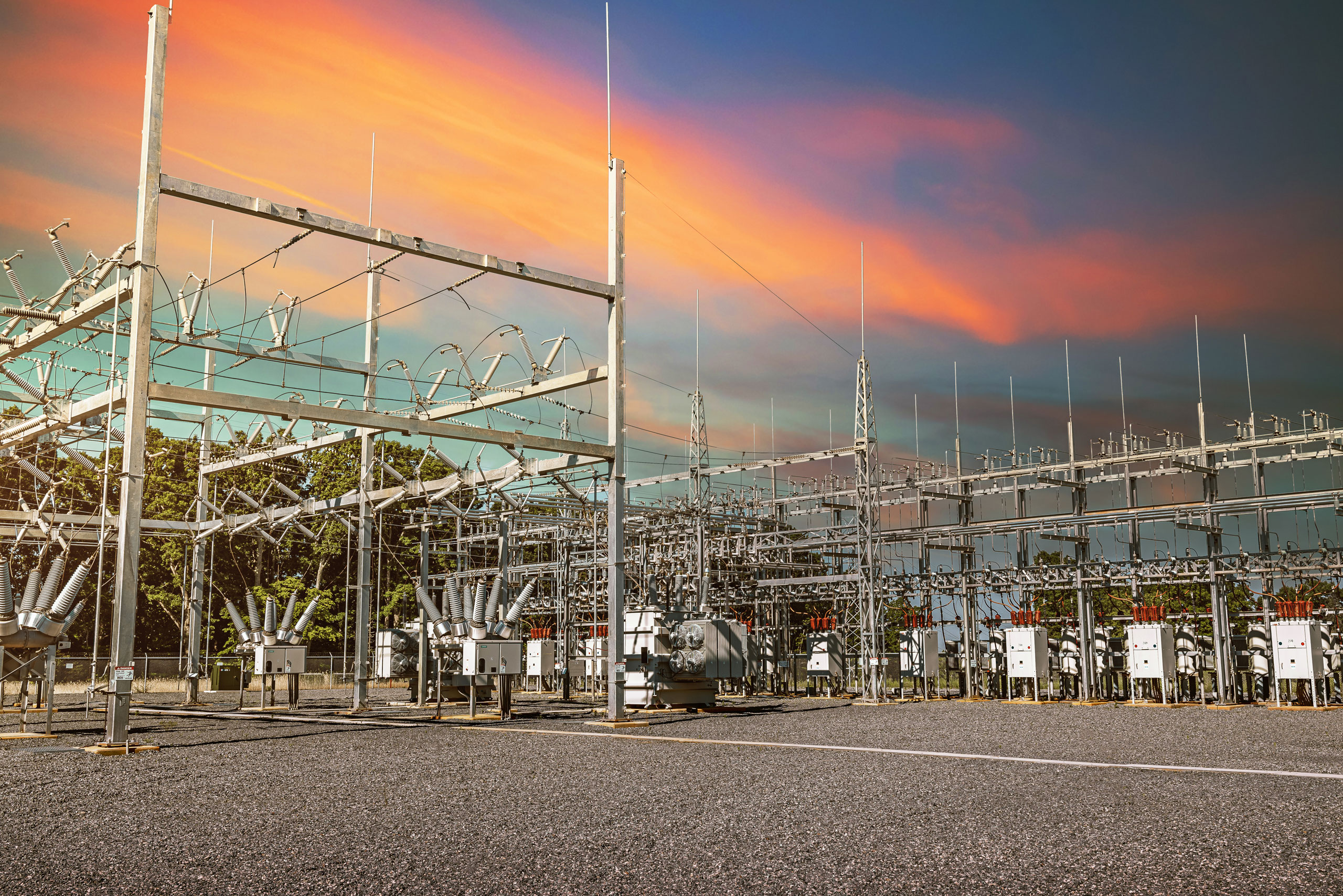 Substation power station with sunset clouds behind