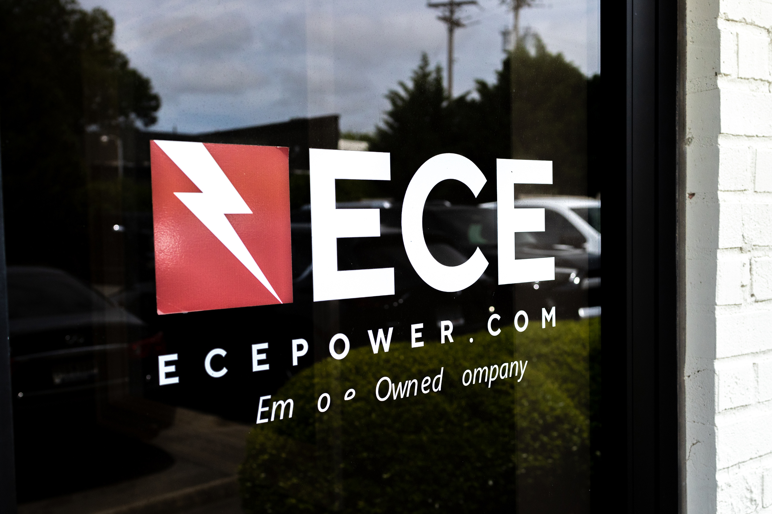 Closeup of the ECE Power logo graphic on the office windows